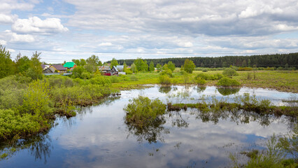 A majestic river winds its way through a dense, vibrant green forest, creating a mesmerizing scene of natures beauty and tranquility