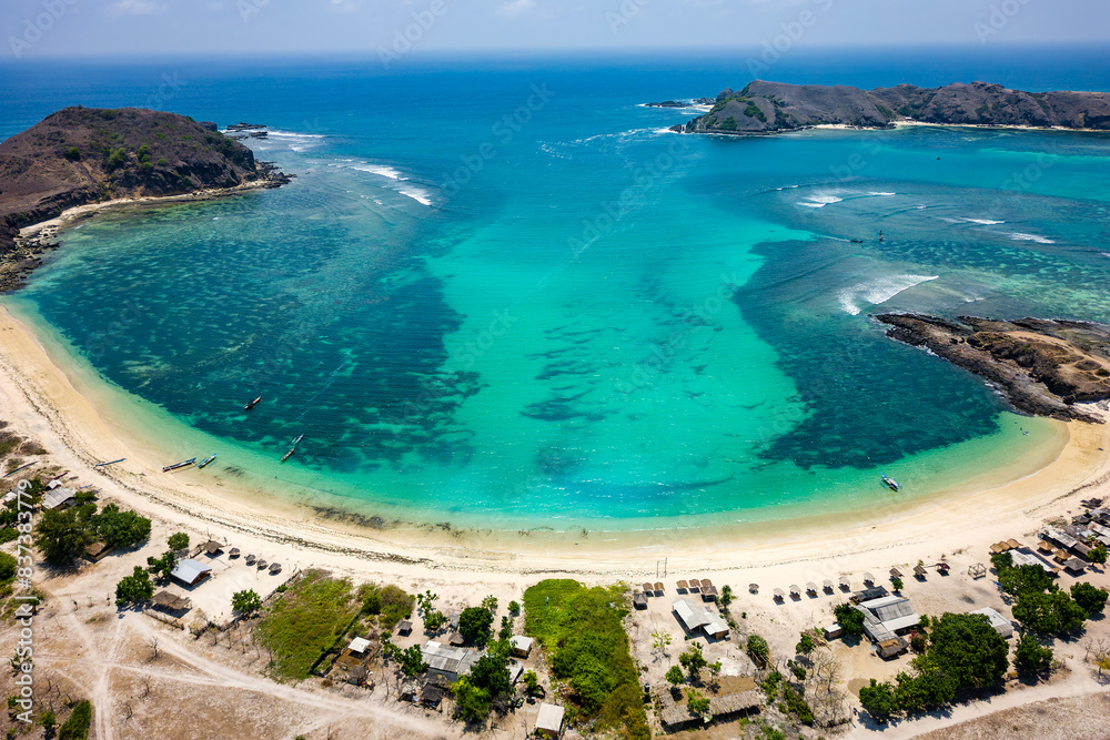 Wall mural panoramic aerial view of a stunning tropical beach inside a sheltered bay and warm ocean (lombok, in