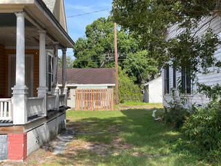 Old vintage wooden homes through a pathway background