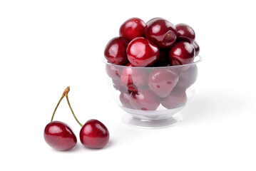 Ripe natural cherries, sweet cherries in a glass bowl on a white background