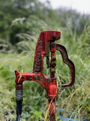 Close-up of an old, rusted water pump