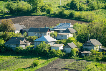 Rural buildings, farmland in the background © Andrzej