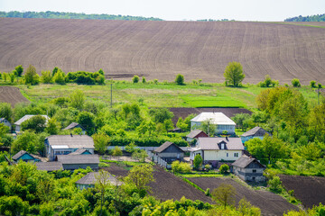 Rural buildings, farmland in the background © Andrzej