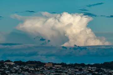 Cumulonimbus is a dense, towering vertical cloud, Towering cumulonimbus clouds are typically...