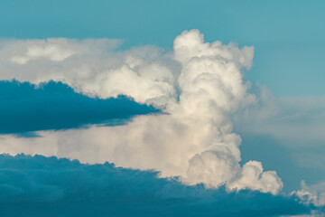Cumulonimbus is a dense, towering vertical cloud, Towering cumulonimbus clouds are typically accompanied by smaller cumulus clouds. Honolulu Oahu Hawaii