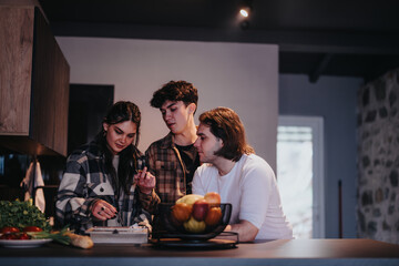 Casual gathering of friends engaging in conversation and activities in a cozy home kitchen setting.