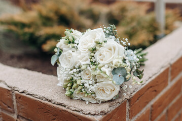 wedding bouquet on bricks in park