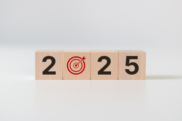 2025 goals of business or life. Wooden cubes with 2025 and goal icon on white background. Starting...