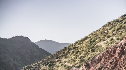 Mountain landscape in the mountains in the evening at sunset for background in the mountains of Tajikistan, the texture of hills and high mountains minimalist in the evening