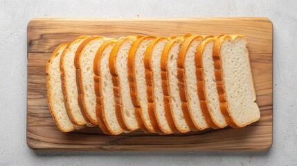 Top view of freshly sliced bread arranged neatly on a wooden cutting board
