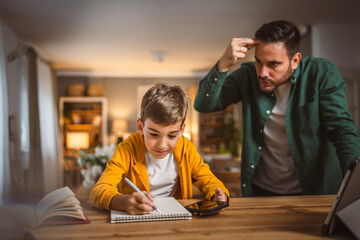 Angry father yell at his son to do homework as soon as possible