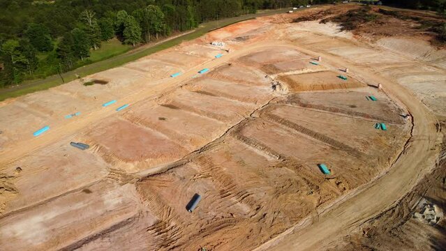 Graded dirt lots ready for new house and neighborhood construction