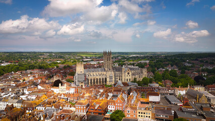 Flight over the city of Canterbury United Kingdom with famous Canterbury Cathedral on a sunny day -...