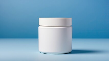 Plain white cosmetic jar on a clean blue background, perfect for skincare product concepts