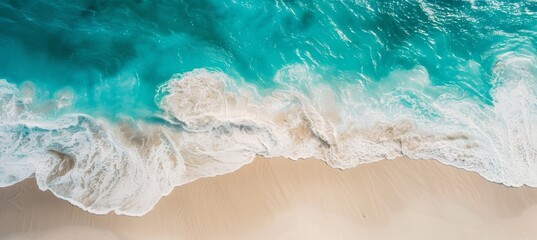 Obraz premium Beautiful aerial view of white sandy beach and turquoise ocean waves, top down view, minimalist, high resolution photography
