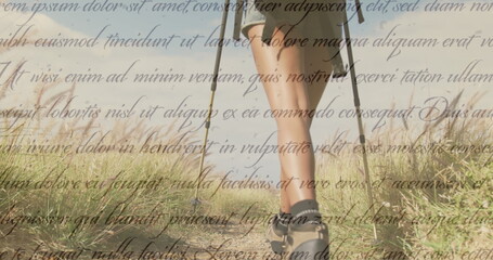 Image of independence day text over diverse couple hiking