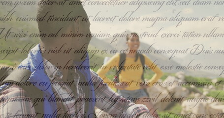 Image of independence day text over smiling diverse couple hiking