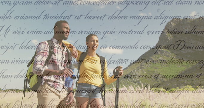 Image of independence day text over smiling diverse couple hiking - Powered by Adobe