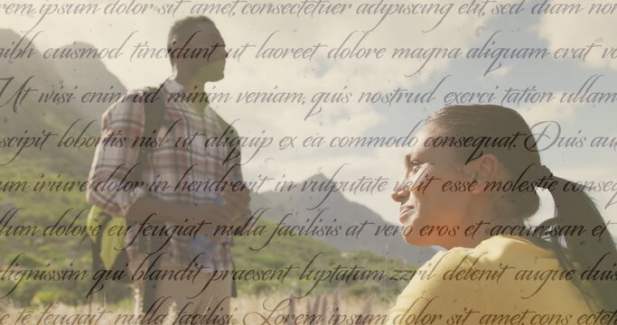 Image of independence day text over smiling diverse couple hiking - Powered by Adobe