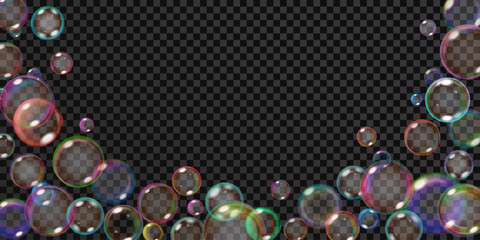 Lots of translucent rainbow soap bubbles located at the bottom and sides, isolated on a transparent background. Best used on dark illustrations. Transparency only in vector format.