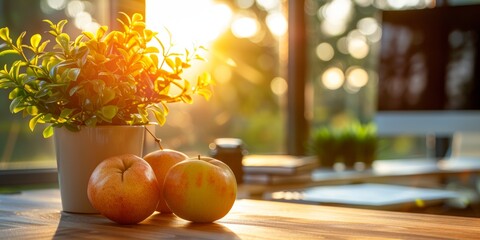 A serene morning in a home office with three apples, potted plant with sunlight streaming through the window, creating a warm and inviting atmosphere