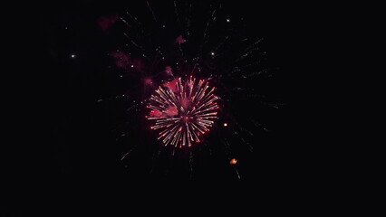 Festive colorful fireworks in night sky, independence day. Glowing Christmas fireworks. Shining...