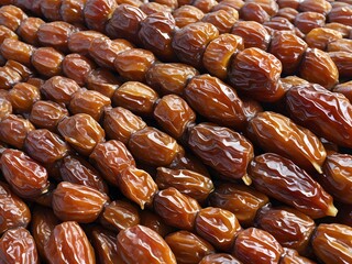 dates close up. date palm background. Date palm on a traditional craftsman market.Horizontal image.