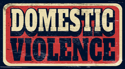 Aged and worn domestic violence sign on wood