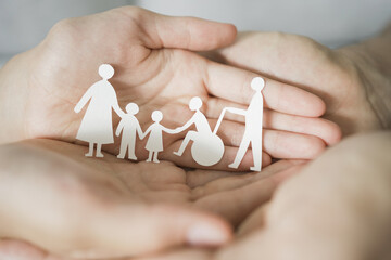 Hands holding diversity family, happy carer and volunteer, disable nursing home, rehabilitation and...