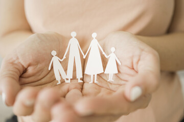 hands holding paper family cutout, foster care, homeless support, world mental health day, Autism...