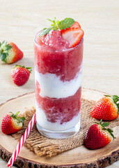 Strawberry Yogurt Shake blended on a wooden table