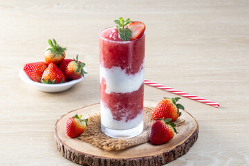 Strawberry Yogurt Shake blended on a wooden table