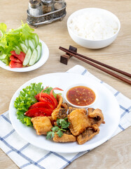 Crispy fried fish on the wooden table
