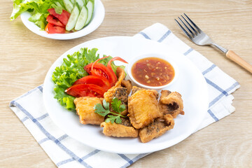 Crispy fried fish on the wooden table