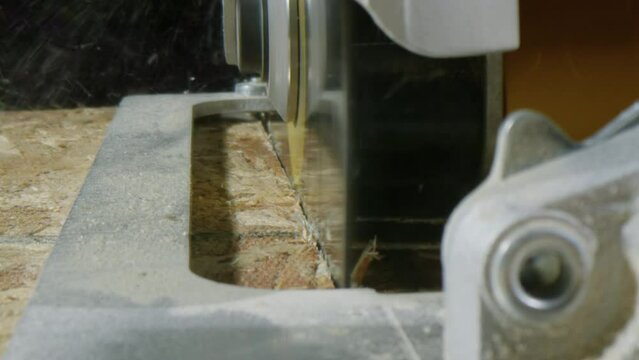 Circular Saw Cutting Piece of Wood, Dolly Push In, Extreme Close Up, 4K