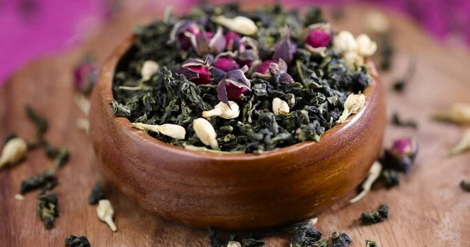 natural Dried green tea with jasmine and rose, dried tea leaves with jasmine flowers and dried rose