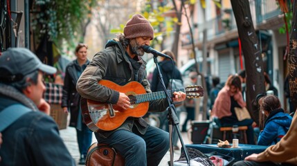 Fototapeta premium A street musician playing guitar, with passersby stopping to listen, capturing the connection through music