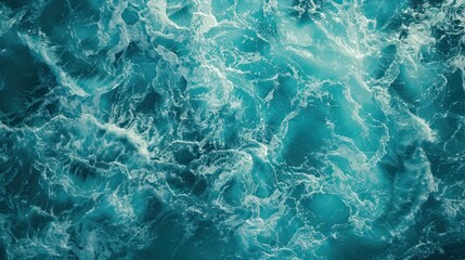 Fototapeta premium Turquoise foam surface of the blue sea with waves The water surface is blue foam.