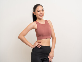 Young beautiful smiling asian woman with sportswear on isolated white background. Portrait happy healthy slim fit and firm latin attractive sporty woman standing pose exercise workout in studio.