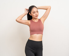 Young beautiful smiling asian woman with sportswear on isolated white background. Portrait happy...