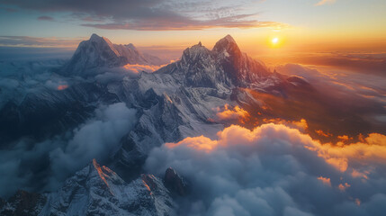 Fototapeta premium Warm golden hues of the sunrise casting a gentle light on the mountains.