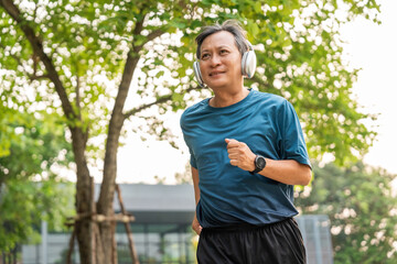 Senior old man runner exercise outdoor nature park. fitness man jogging wearing sportswear. Mature athlete man in sportswear Workout running at public park. Health and activity old man lifestyle