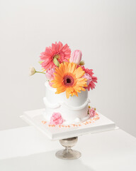 White Birthday cake with flower decoration on white background.food concept anniversary background.