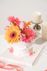 White Birthday cake with flower decoration on white background.food concept anniversary background.