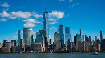 New York, United States. New York city skyline in Midtown Manhattan. USA, NYC, NY, Manhattan. American big city. Lower Manhattan skyline. New York from New Jersey. Downtown Manhattan with blue sky.
