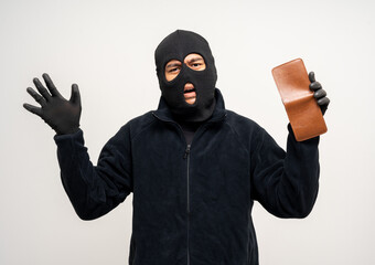 Thief in uniform black jacket various pose on isolated background. The Robber terrorism criminal escapes with balaclava and crowbar entering a house for stealing Housebreak