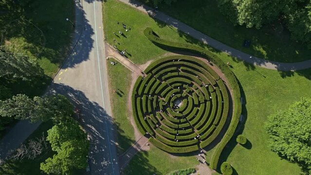 Tourists wander through the maze at Slottsskogen Labyrinth in the center of Gothenburg, Sweden