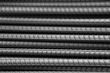 Deformed Bar is a steel bar with surface projections that increase its bond strength when used in reinforced concrete.