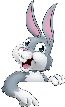 recommend clip art: An Easter bunny rabbit cartoon character peeking around a sign