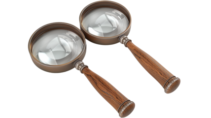 Three magnifying glasses with wooden handles of different sizes isolated on a transparent background